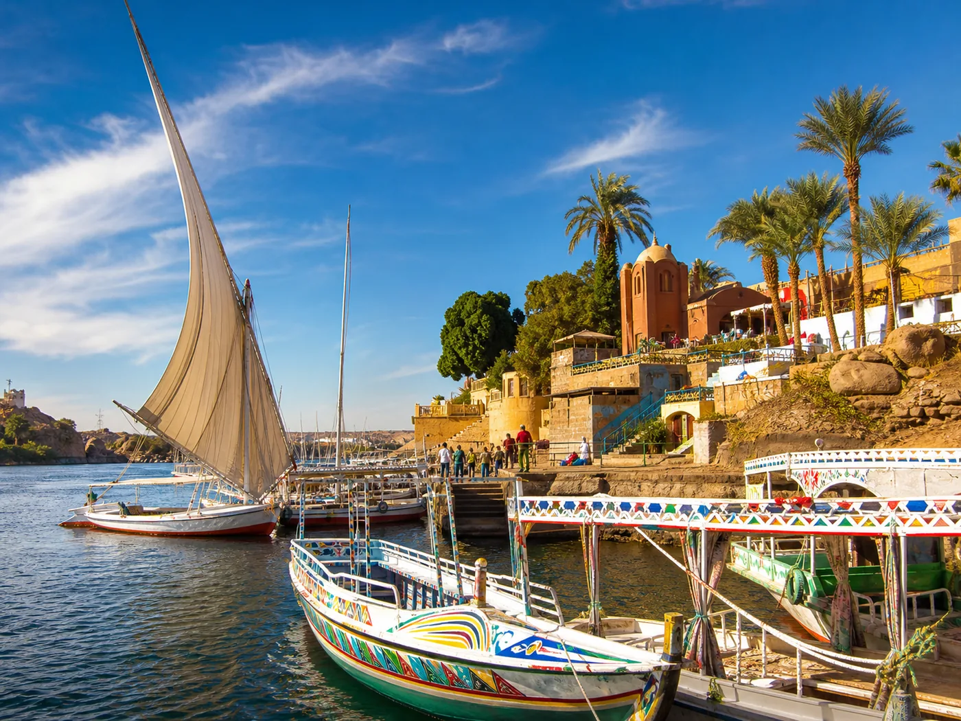 Colourful Nubian boats and a lively river port in Aswan