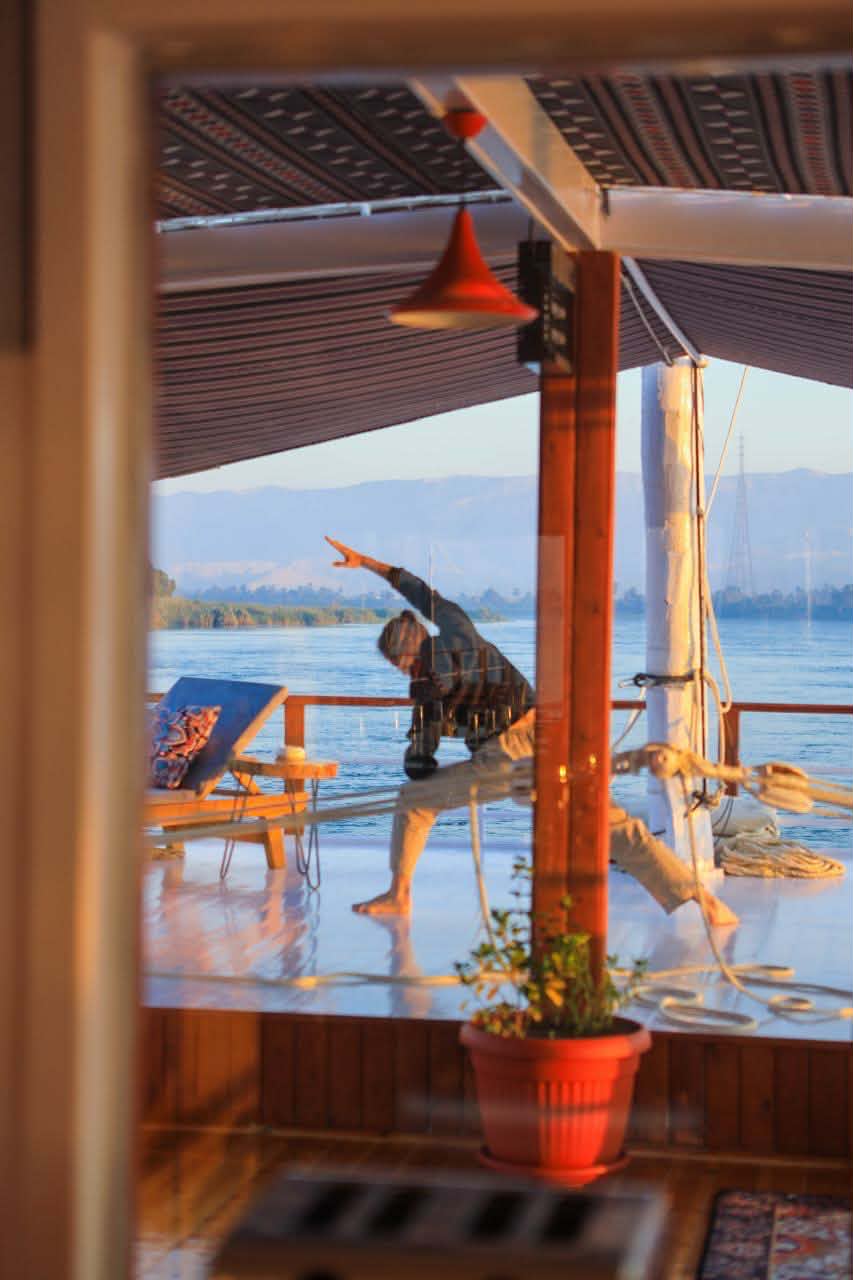 Morning movement practice on the dahabiya deck beside the Nile
