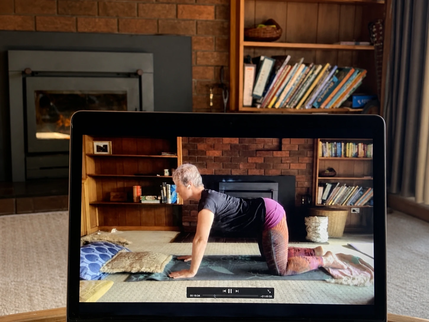 One of Mel's recorded online yoga classes playing on a laptop